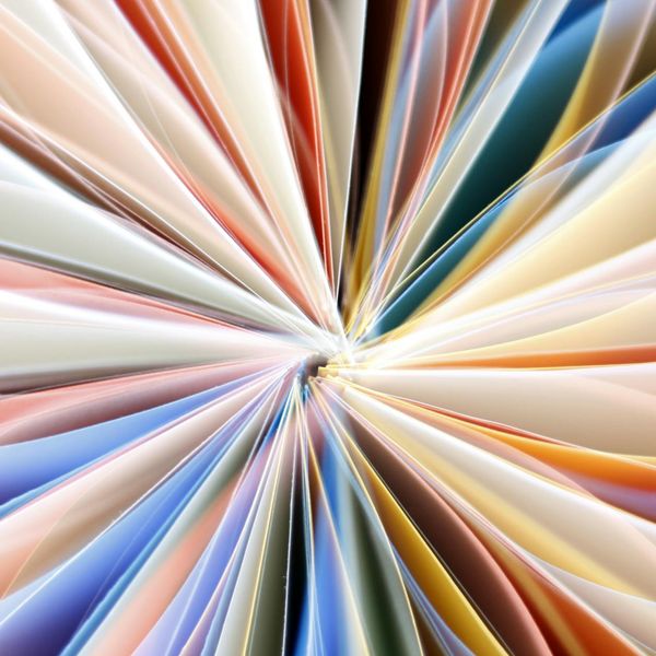 Abstract image of golden light rays converging to a single point, symbolizing focus.
